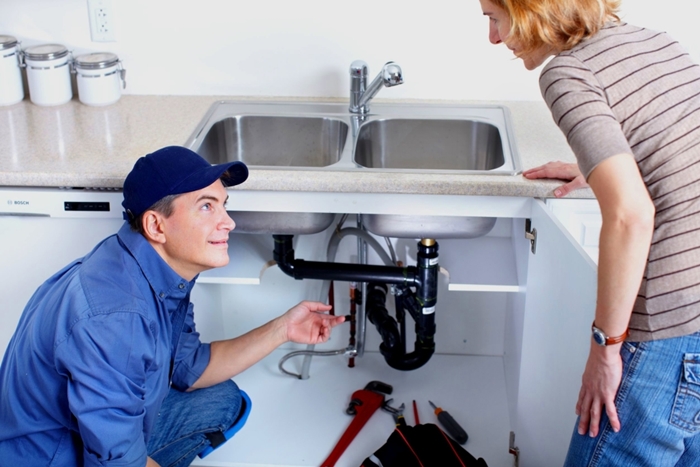 plumber repairing sink